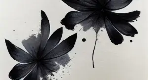 Abstract black flower-like paint splatters on a light background