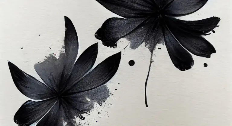 Abstract black flower-like paint splatters on a light background