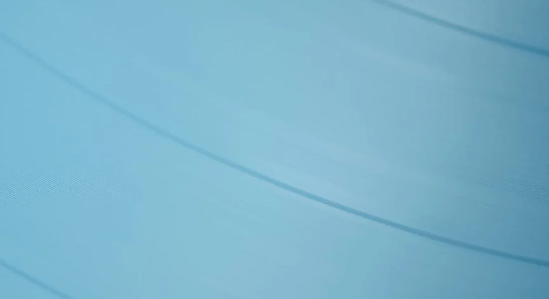 Abstract blue curves on a light blue background representing decision-making about vinyl wrap installation