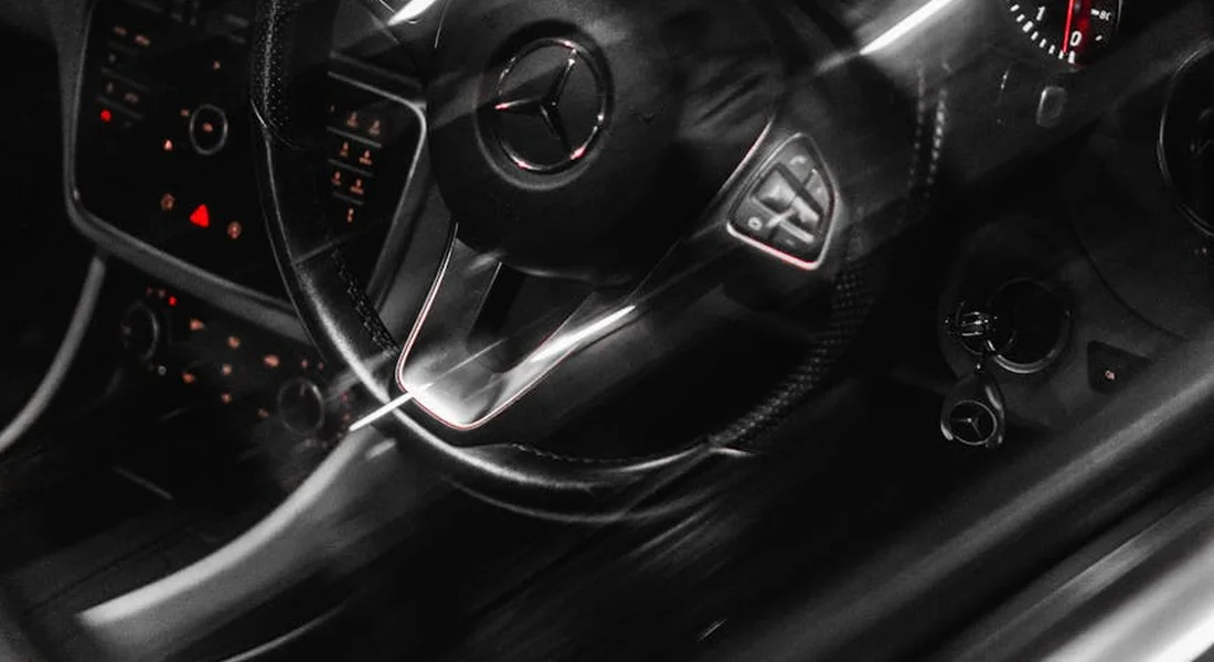 Close-up of a car's dashboard and steering wheel, showing interior plastic surfaces prone to scratches.