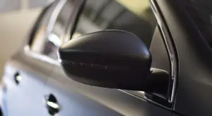 Close-up of a wrapped car's side mirror
