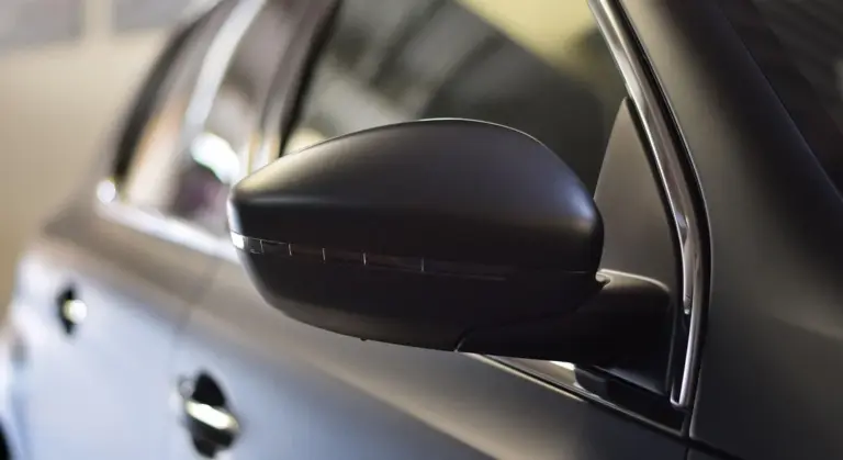 Close-up of a wrapped car's side mirror