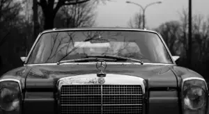 Front view of a classic black-and-white car emphasizing glossy paint and opportunities for color changes or special finishes.