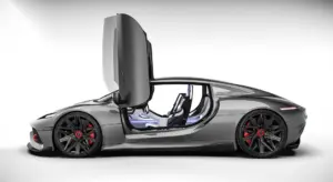 Gray luxury sports car with upward-opening doors in a studio setting, exposing a sleek interior.